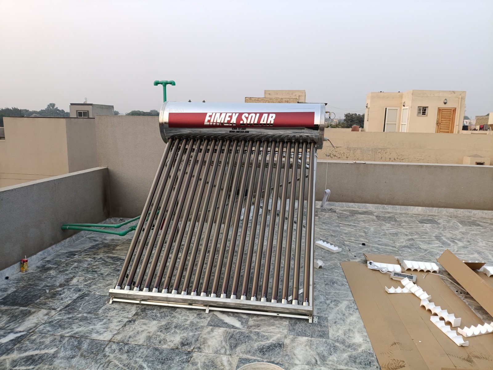 EIMEX solar geyser installed on a marble-tiled residential rooftop