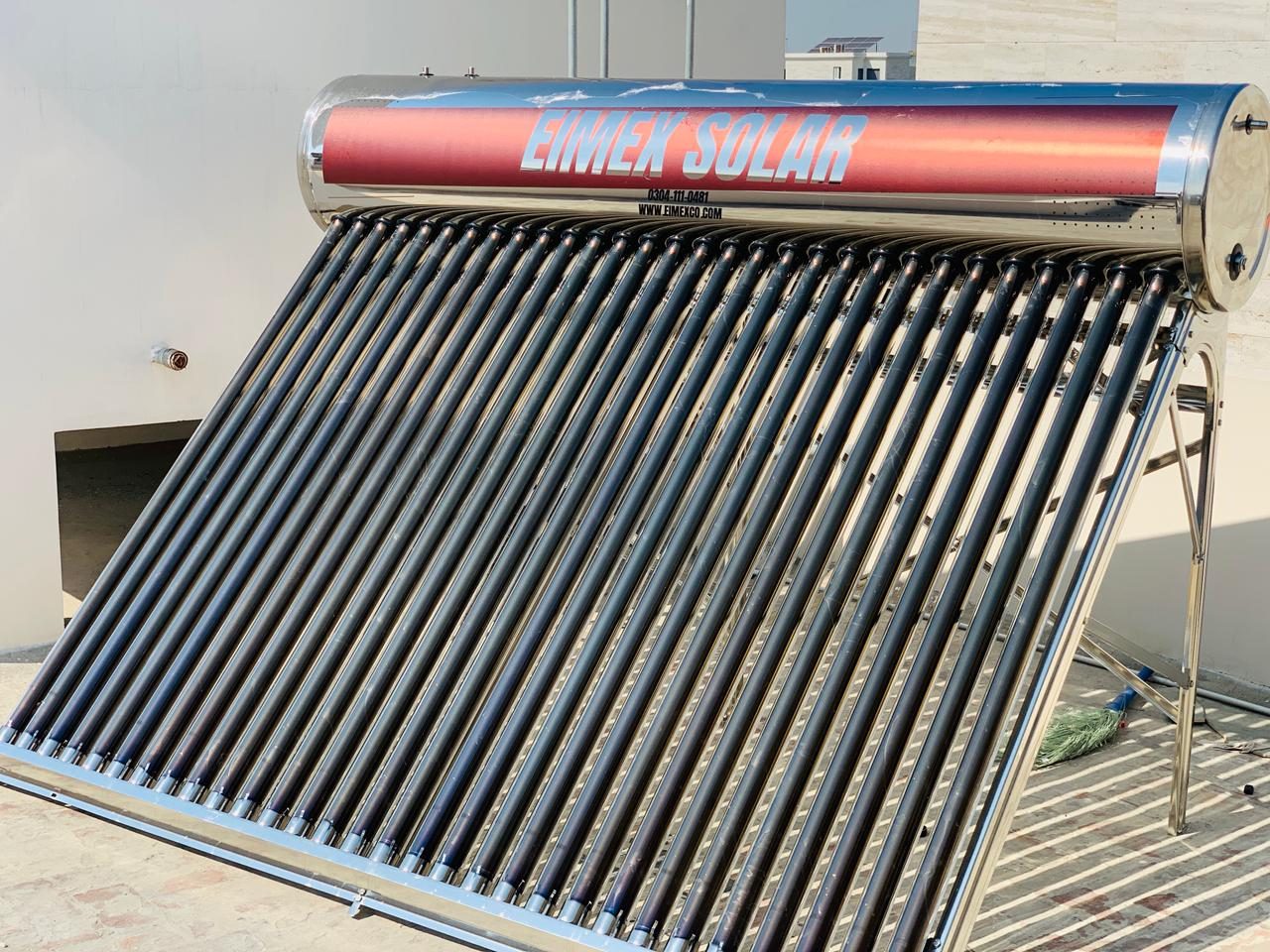 EIMEX solar geyser installed on a rooftop, showing the stainless tank and row of evacuated vacuum tubes
