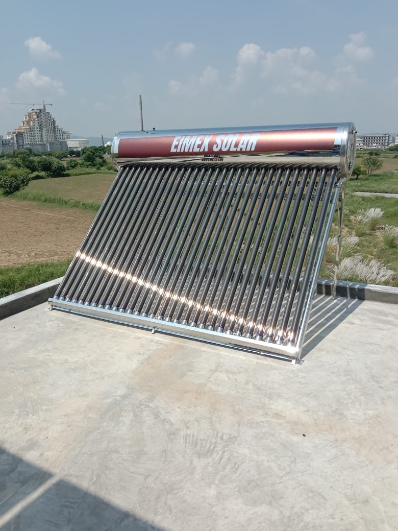 EIMEX solar geyser mounted on a rooftop with open fields behind it